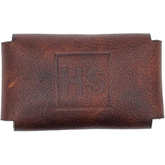 Brown leather razor head cover from Pasteur Pharmacy with the Henson logo, designed to protect and store razor heads.