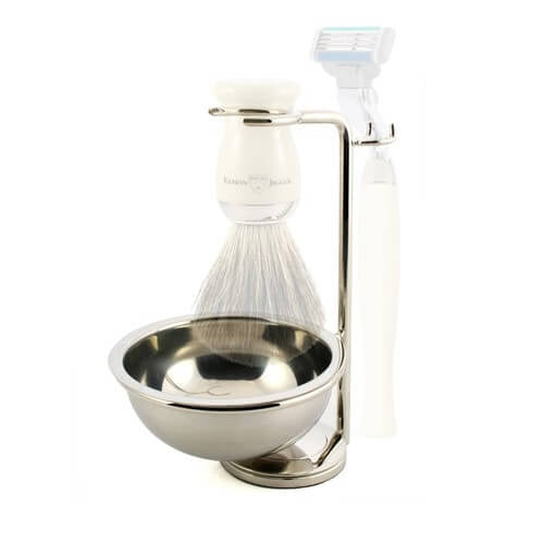 Nickel-plated Edwin Jagger razor stand with shaving brush and razor, designed for elegant grooming on a bathroom counter.