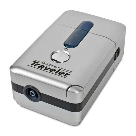 DeVilbiss Traveler portable compressor nebulizer system for respiratory care, compact device with tubing and mask visible.
