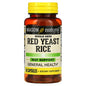 Red Yeast Rice herbal capsules from Mason Natural, showing the beige capsules in a clear container on a white background.