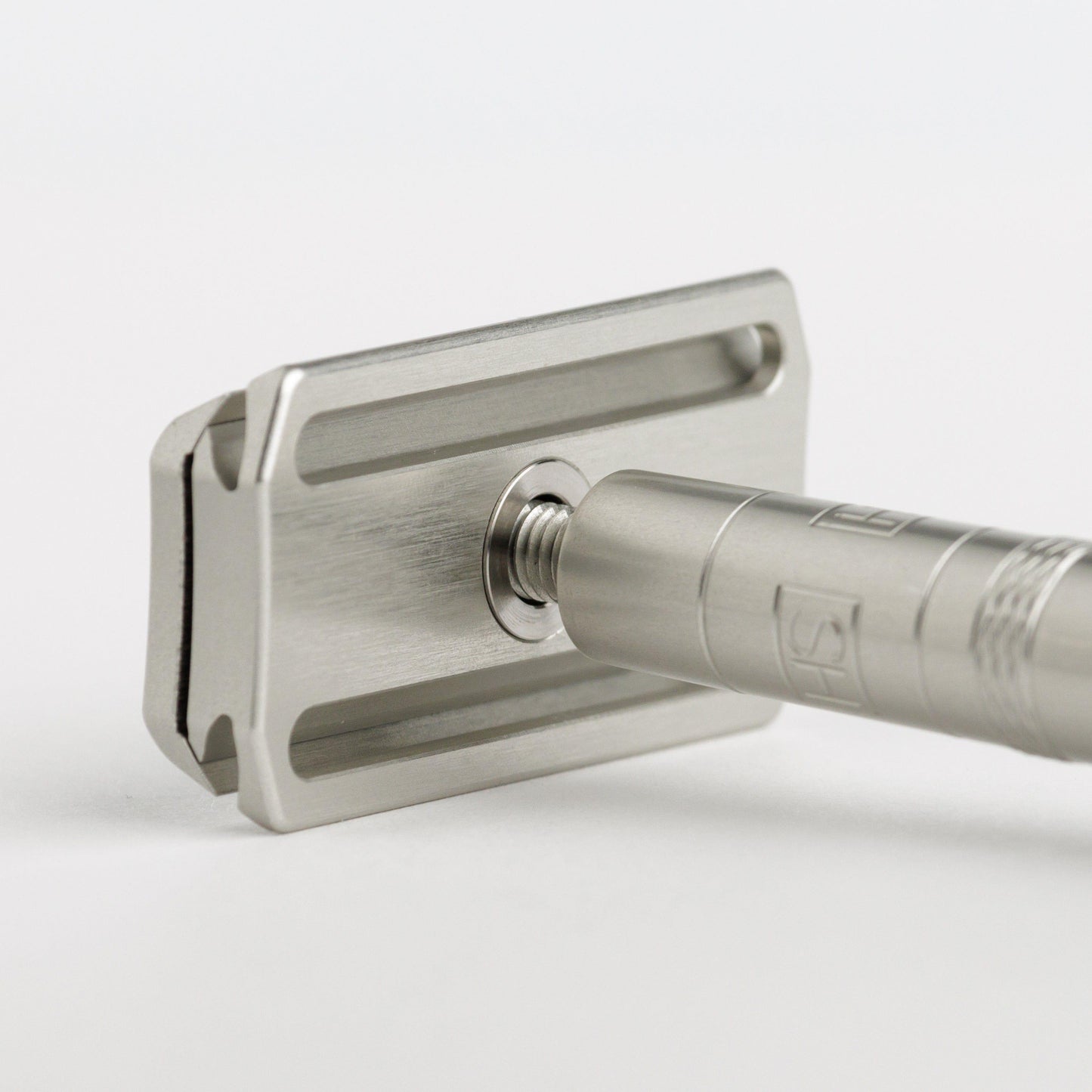 Henson Shaving AL13-V2 Medium Safety Razor with aircraft aluminum handle, detailed close-up of safety razor for a clean shave.