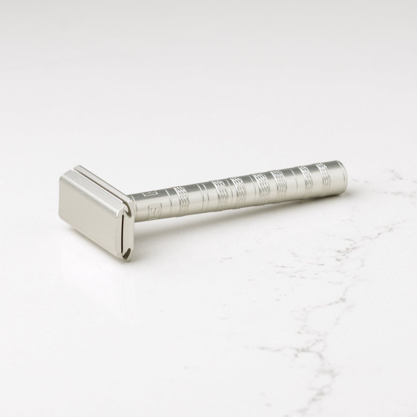 Henson Shaving AL13-V2 mild safety razor with aircraft aluminum handle, designed for a smooth shave.