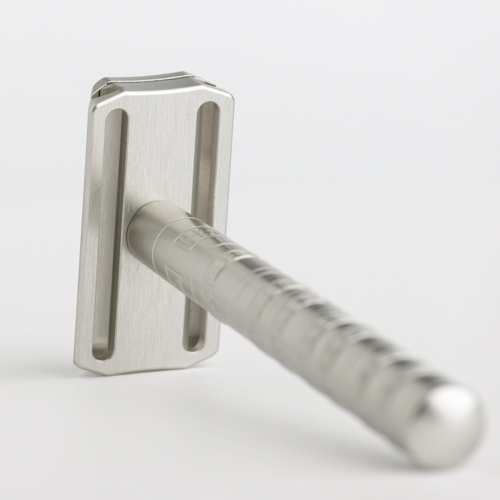 Henson Shaving AL13-V2 mild safety razor with aircraft aluminum handle, positioned on a white background.