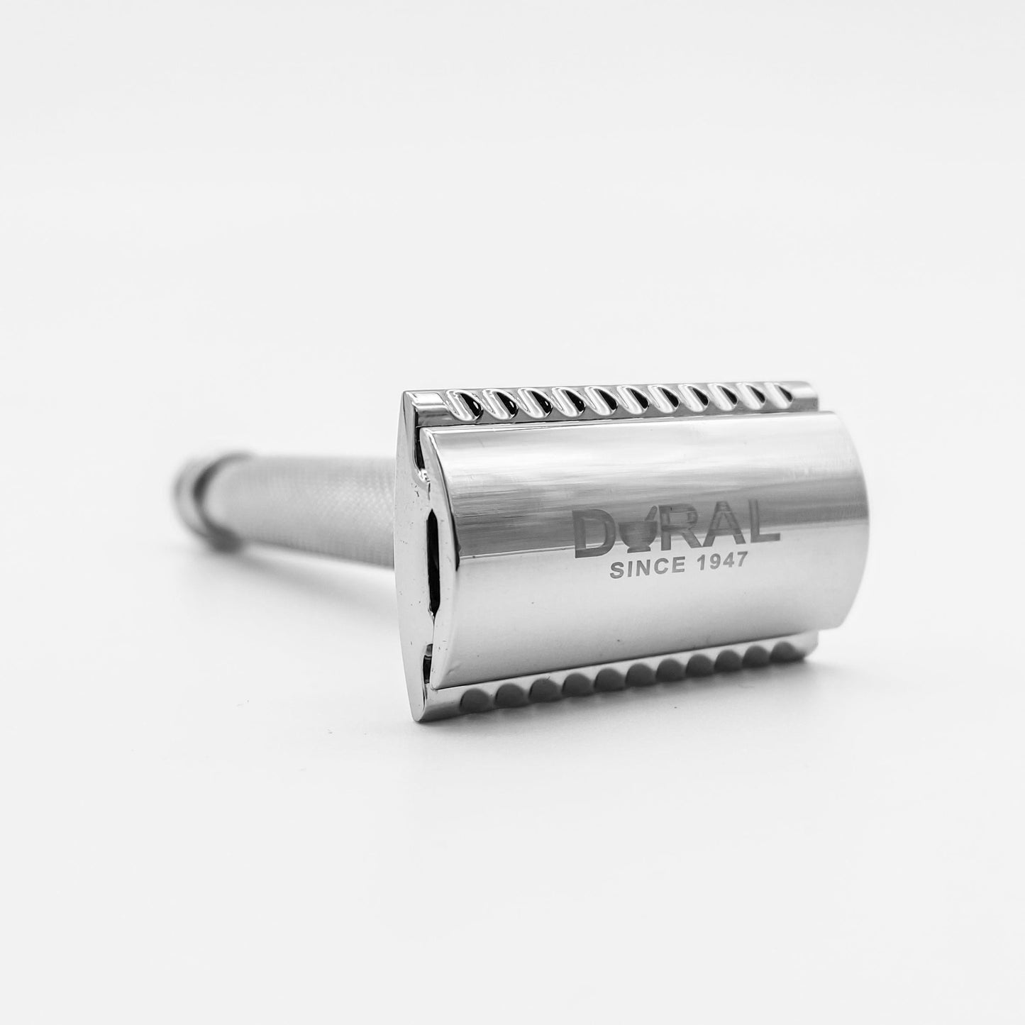 Chrome double-edge safety razor by Pasteur Pharmacy with a pouch, featuring a sleek handle and classic safety razor design.