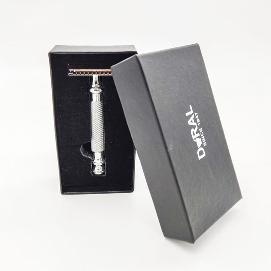 Dural Havick double edge safety razor from Pasteur Pharmacy with a black storage pouch, featuring a sleek metal handle and safety guard.