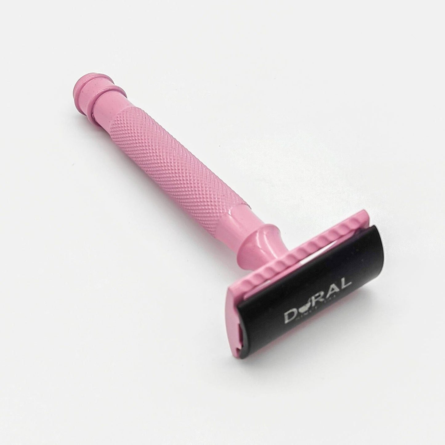 Dural Heavy Stroud Head safety razor by Pasteur Pharmacy with pink and black design, shown with protective pouch.