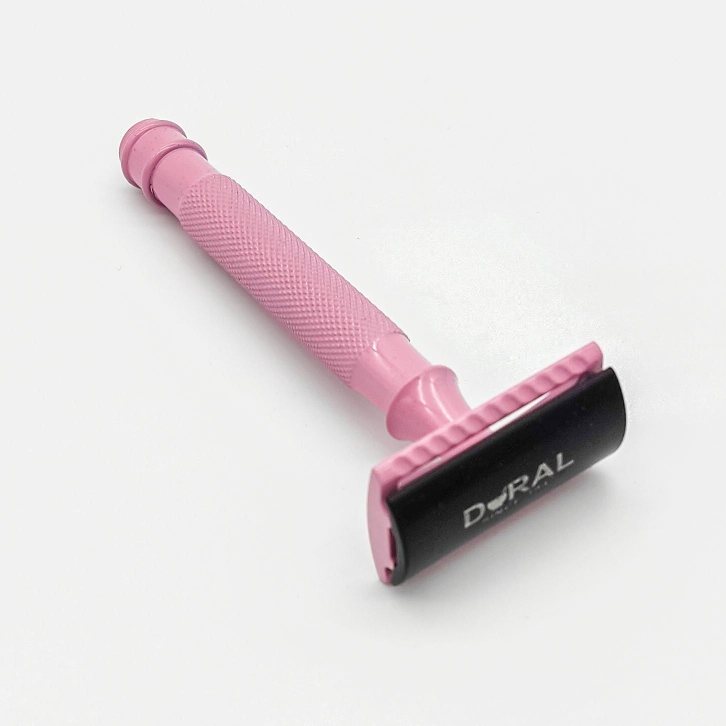 Dural Heavy Stroud Head safety razor by Pasteur Pharmacy with pink and black design, shown with protective pouch.