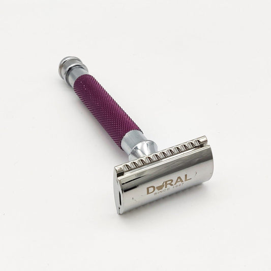 Dural Heavy Stroud Head double-edge safety razor in purple with pouch, by Pasteur Pharmacy, showing the sleek razor design and storage pouch.