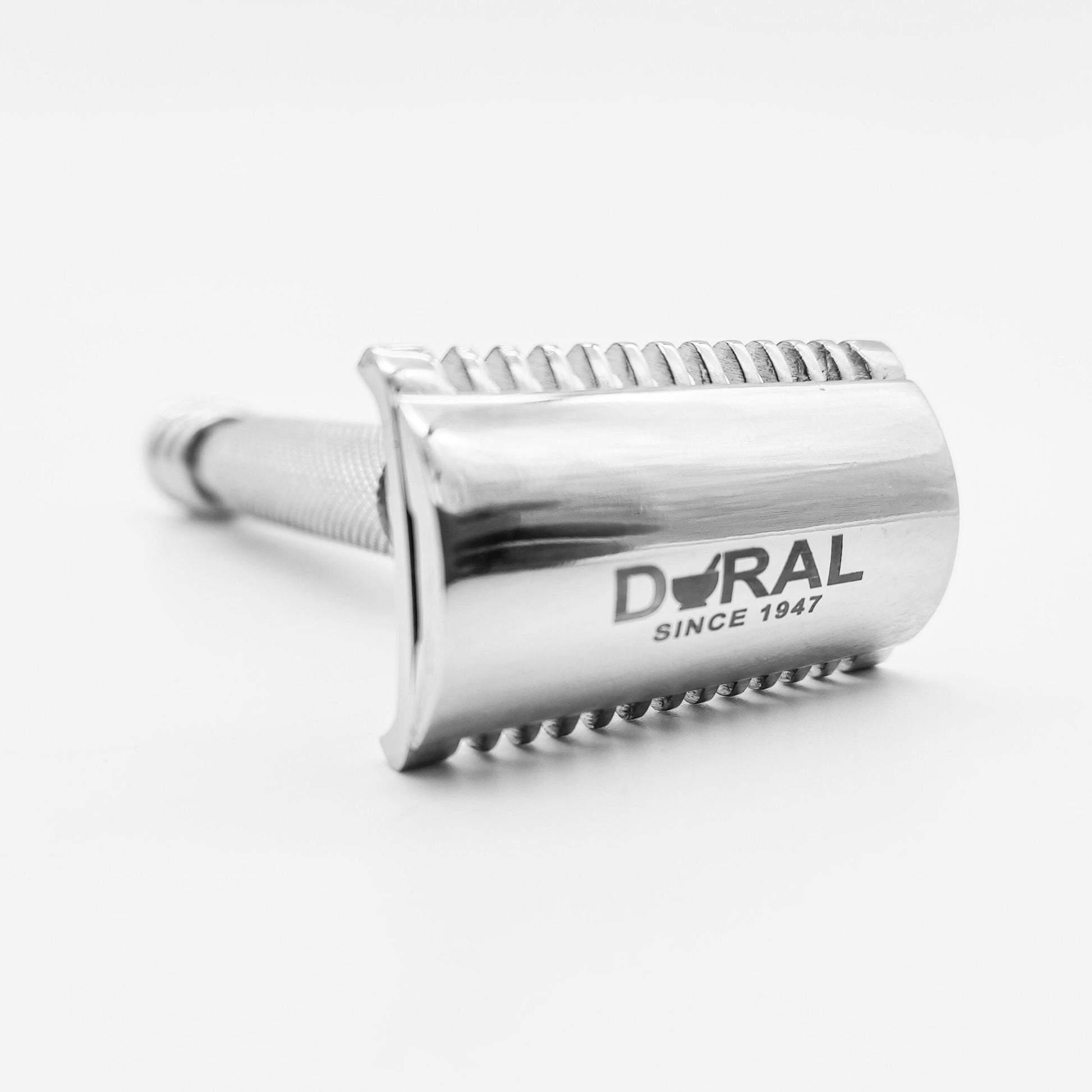 Dural Stounton open comb double edge safety razor by Pasteur Pharmacy with leather pouch, featuring a sleek metal handle and safety guard.