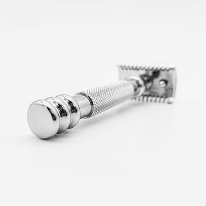 Dural Stounton open comb double edge safety razor by Pasteur Pharmacy with black pouch, metal handle, and safety guard.