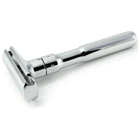 Polished Merkur Futur adjustable safety razor with blades and gift packaging displayed on a clean surface.