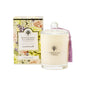 Wavertree & London Flower Market scented candle in a glass jar with a floral label, emitting a warm glow.