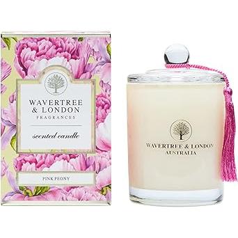 Scented candle by Wavertree & London with pink peony fragrance, featuring a stylish glass container and soft pink wax.