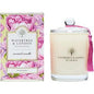 Scented candle by Wavertree & London with pink peony fragrance, featuring a stylish glass container and soft pink wax.