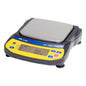A&D Newton EJ-610 portable precision balance displaying a digital screen and weighing samples in a science laboratory setting.