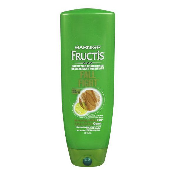 Fructis Garnier Fall Fight Conditioner in a 13 fl oz bottle, part of shampoo and conditioner collection, displayed on a white background.