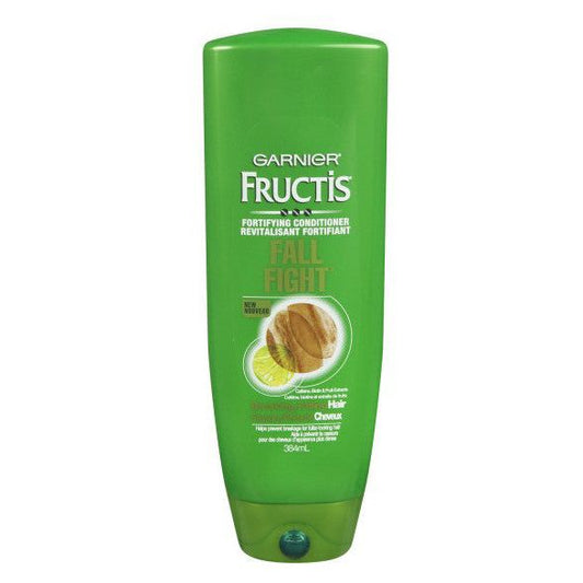 Fructis Garnier Fall Fight Conditioner in a 13 fl oz bottle, part of shampoo and conditioner collection, displayed on a white background.