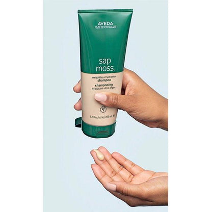 Aveda Sap Moss Weightless Hydration Shampoo bottle from Pasteur Pharmacy, 6.7 fl oz, with the product label and packaging visible.
