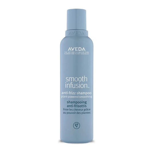 Aveda Smooth Infusion Anti-Frizz Shampoo in a 6.7 oz bottle, designed to tame frizz and smooth hair.