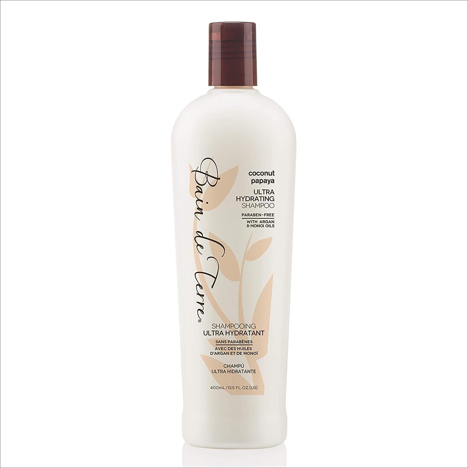 Bain De Terre Coconut Papaya Ultra Hydrating Shampoo bottle from Pasteur Pharmacy, 13.5 fl oz, with coconut and papaya ingredients visible