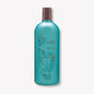 Bain de Terre Jasmine Moisturizing Shampoo bottle, 13.5 oz, with floral jasmine scent and clear shampoo liquid visible.