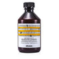 Davines Naturaltech Nourishing Shampoo in a white bottle with a pump dispenser, suitable for nourishing hair.