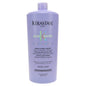 Kerastase Blond Absolu Bain Ultra-Violet Shampoo 34 oz, purple shampoo for blonde hair care, displayed in a professional setting