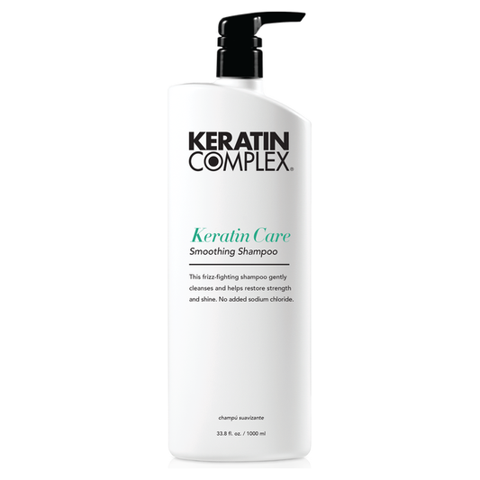 Keratin Complex Smoothing Therapy Shampoo in a 33.8 oz bottle, designed for smoothing and nourishing hair.