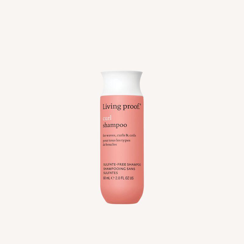Living Proof Curl Shampoo for Waves in 2 oz bottle, moisturizing shampoo designed for curly and wavy hair.