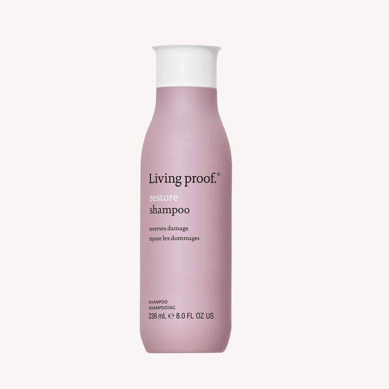Living Proof Restore Shampoo in 8 fl oz bottle, featuring clear liquid and sleek packaging, designed for nourishing hair.