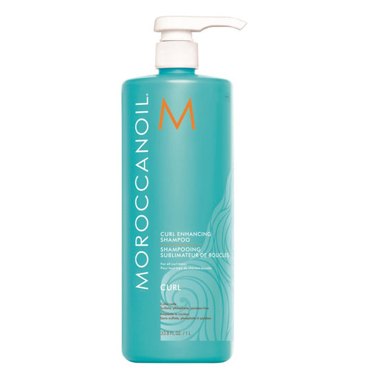 Moroccanoil Curl Enhancing Shampoo for all curl types in a 33.8 oz bottle, natural hair care product with orange and white packaging.