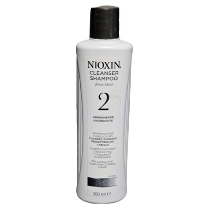 Nioxin Diameter 2 Cleanser Shampoo for natural hair thinning, 10.1 oz bottle, with purple and white branding and product label.