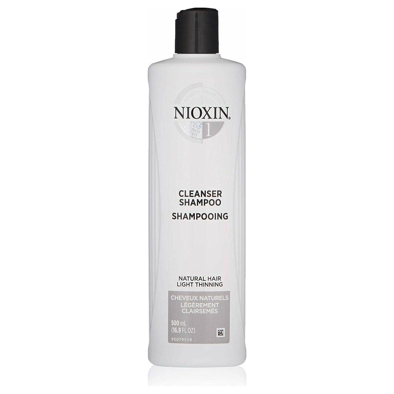 Nioxin System 1 Cleanser Shampoo in a 16.9 oz bottle, designed for thinning hair, with clear liquid and shampoo label visible.