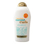 OGX Coconut Curls Shampoo in 19.5 oz bottle, featuring a lathered coconut-scented formula for curly hair.