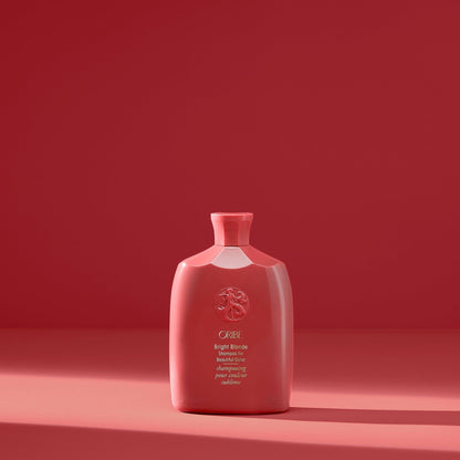 Oribe Bright Blonde Shampoo for beautiful color, 250 ml, with a clear bottle and bright label showcasing the product.