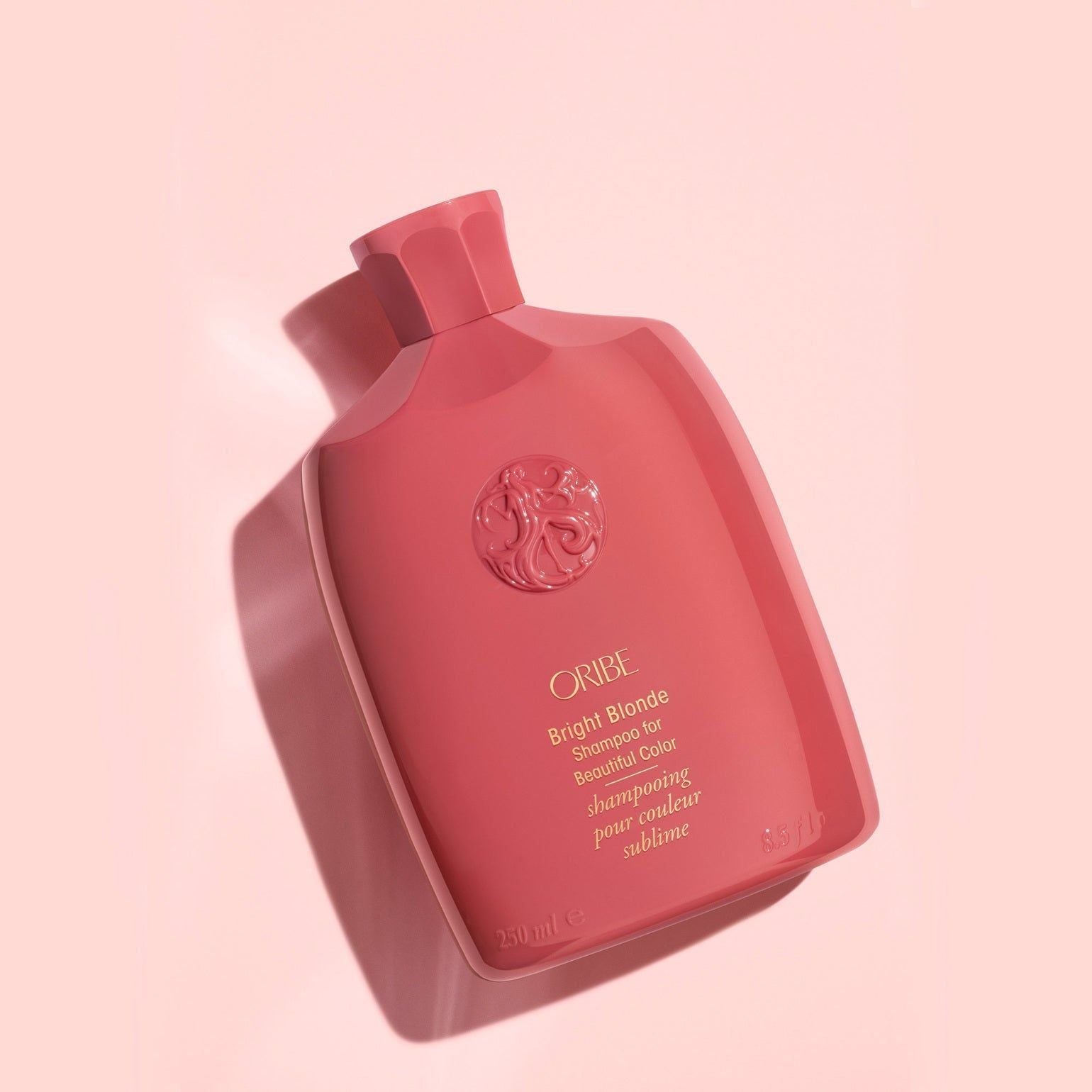 Oribe Bright Blonde Shampoo for beautiful color in 250 ml bottle, featuring a sleek design and bright packaging.