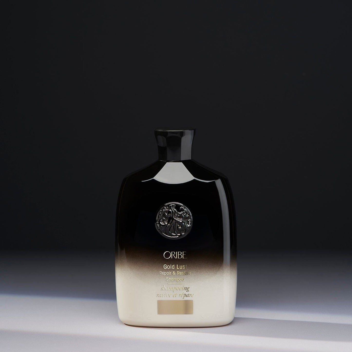 Oribe Gold Lust Repair & Restore Shampoo in 250ml bottle, featuring luxurious hair care formula, shown in sleek packaging.