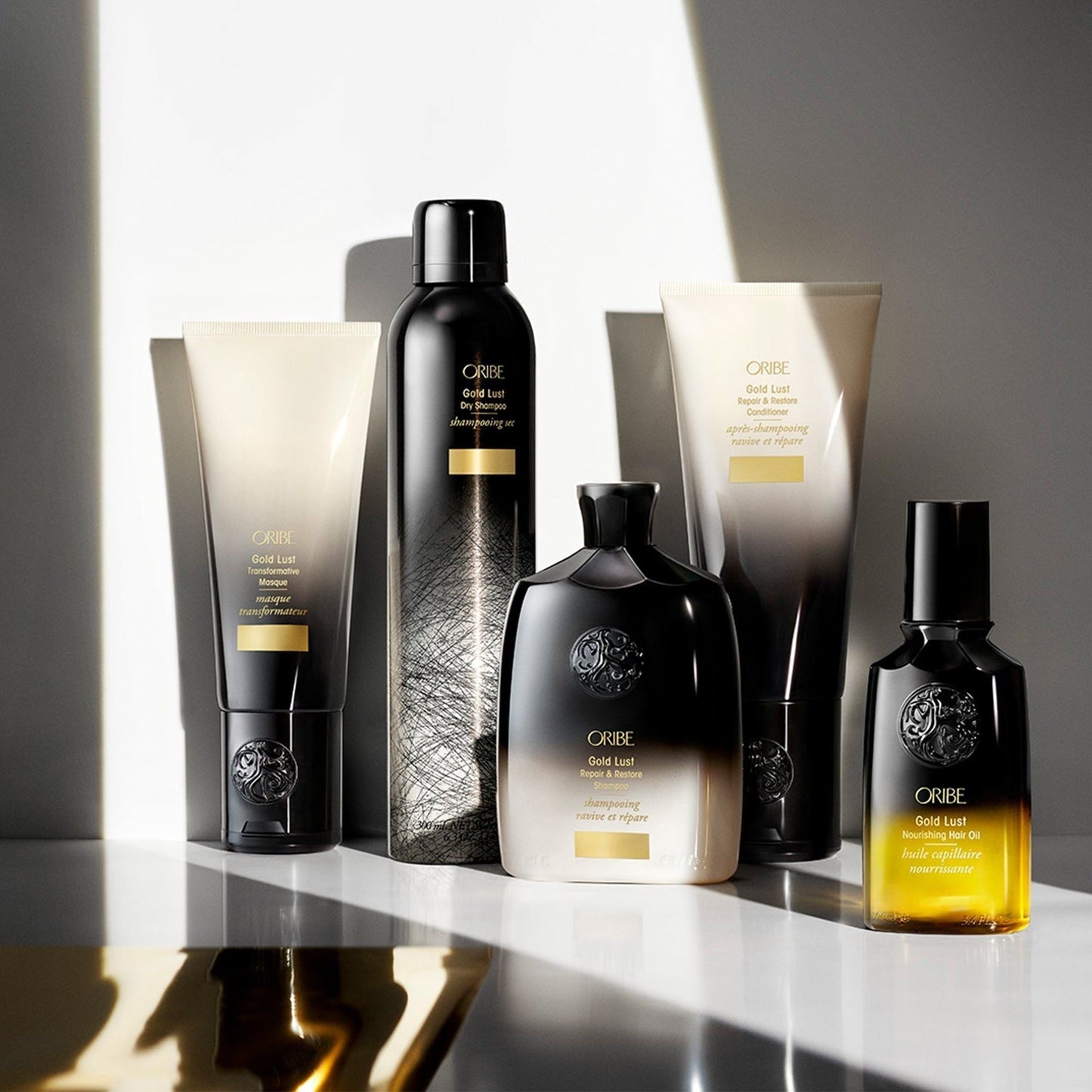 Oribe Gold Lust Repair & Restore Shampoo in 250ml bottle, showing sleek gold packaging and product label.