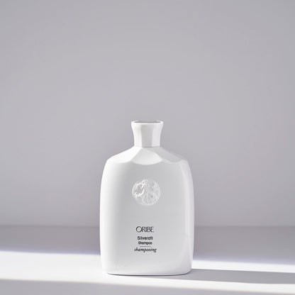 Oribe Silverati Shampoo 250 ml bottle, featuring sleek packaging and product label for maintaining silver hair shine and color.