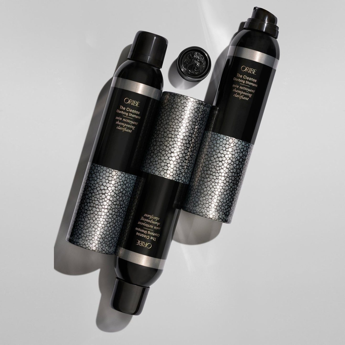 Oribe The Cleanse Clarifying Shampoo in 200 ml bottle, featuring clear liquid and sleek packaging, designed for deep scalp cleansing.