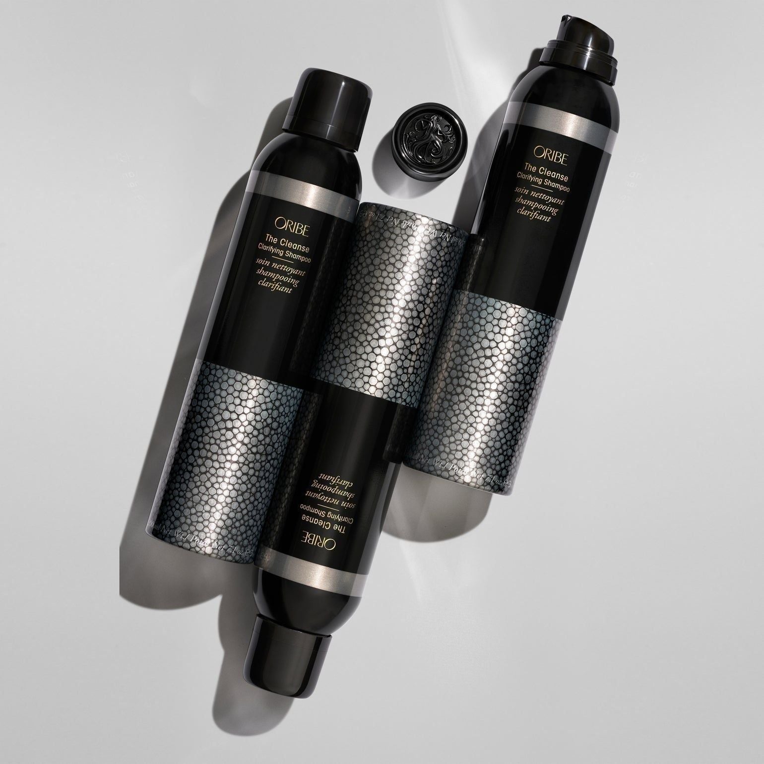 Oribe The Cleanse Clarifying Shampoo in 200 ml bottle, featuring clear liquid and sleek packaging, designed for deep scalp cleansing.