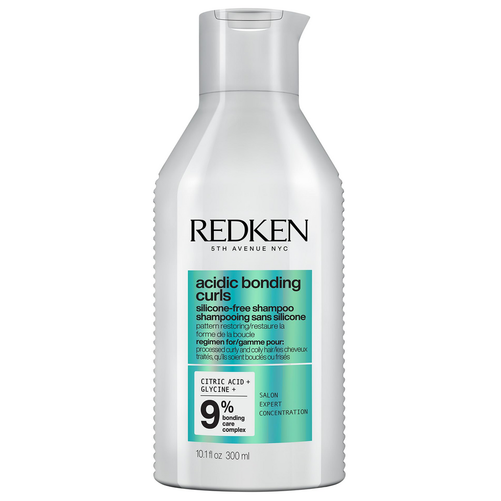 Redken Acidic Bonding Curls silicone-free shampoo bottle, 10.1 oz, designed for curly hair care and bonding treatment.