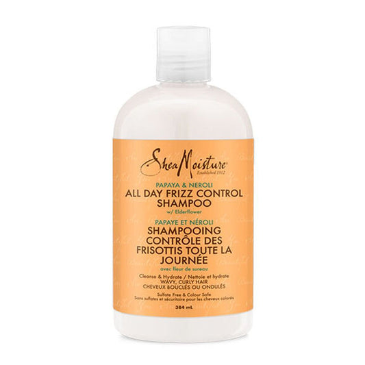 Shea Moisture Papaya and Neroli all-day frizz control shampoo in a clear bottle with a pump dispenser, labeled with product details.