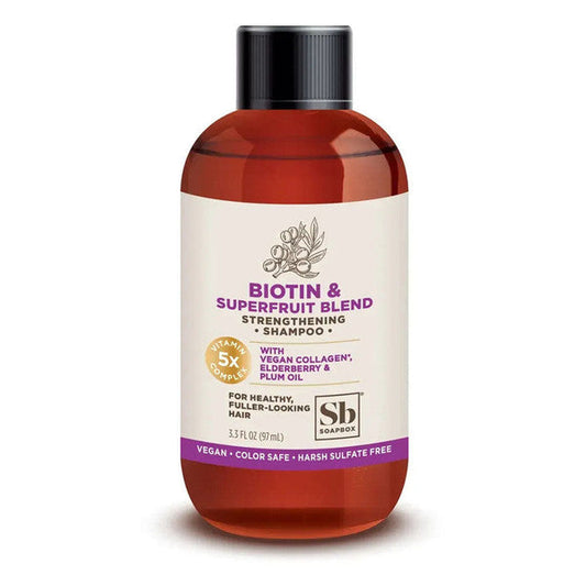 SoapBox Biotin & Superfruit Blend Shampoo bottle from Pasteur Pharmacy, 3.3 fl oz, showcasing the product's label and packaging.