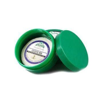 Green Stirling Soap Co. Thick Wall Shave Jar, 4oz, with white lid and textured green exterior, used for storing shaving soap.