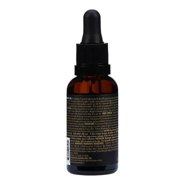 Bottle of Woody's For Men shave oil by Pasteur Pharmacy, 1 fl oz, with natural ingredients for a smooth shave.