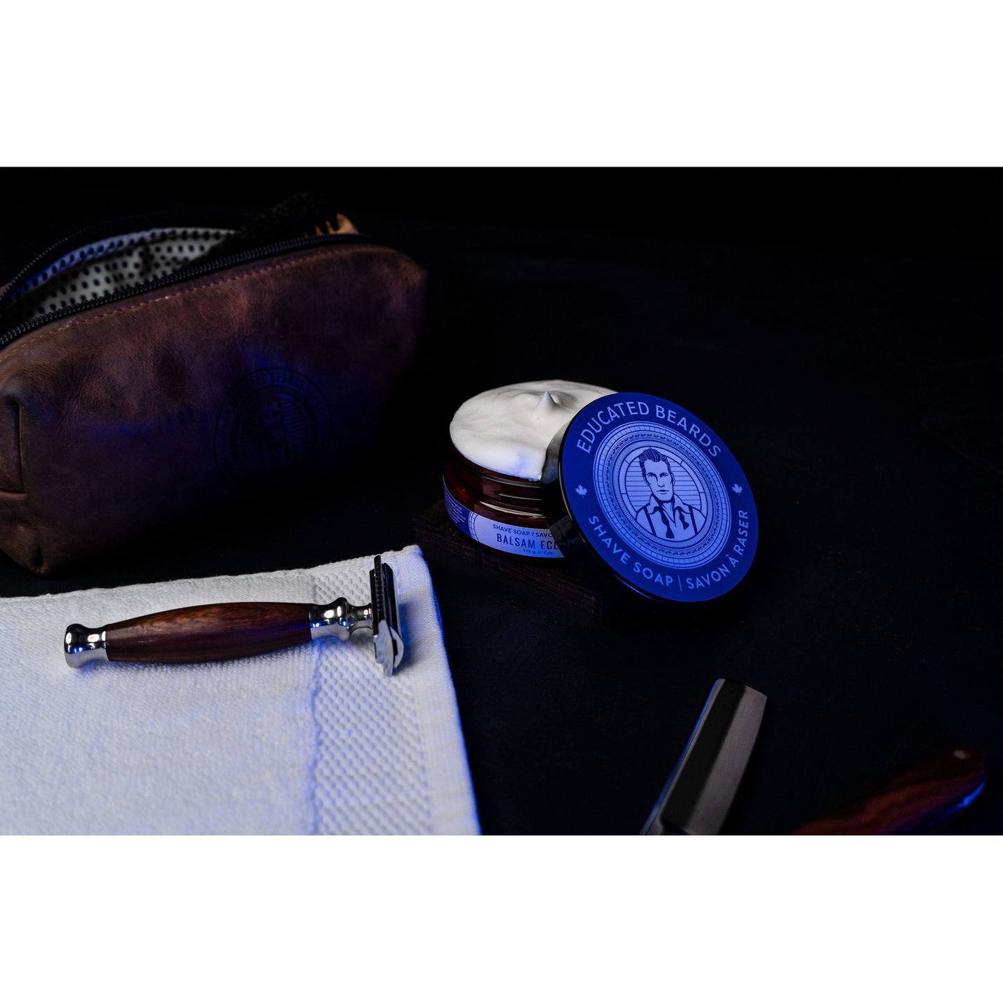 Educated Beards Balsam Eclipse Shave Soap by Pasteur Pharmacy, 4 oz, in a soap dish with a creamy lather.