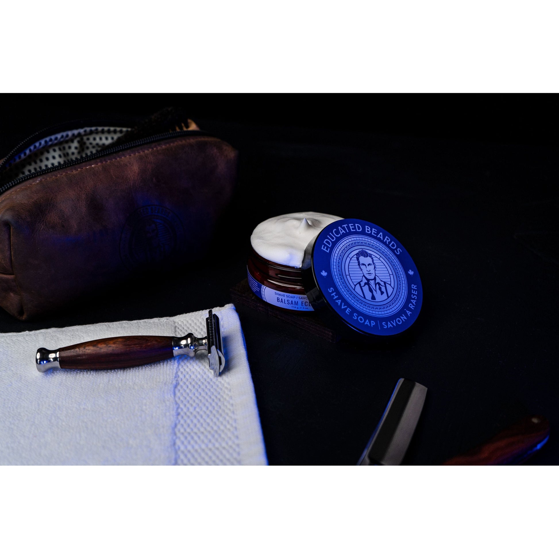 Educated Beards Balsam Eclipse Shave Soap by Pasteur Pharmacy, 4 oz, in a soap dish with a creamy lather.