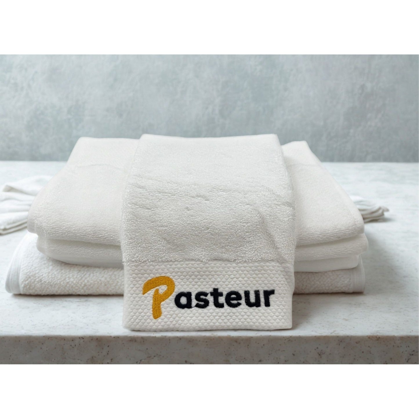 Pasteur Pharmacy Pasteur Shave Towel with classic logo, soft fabric, ideal for shaving comfort and grooming.