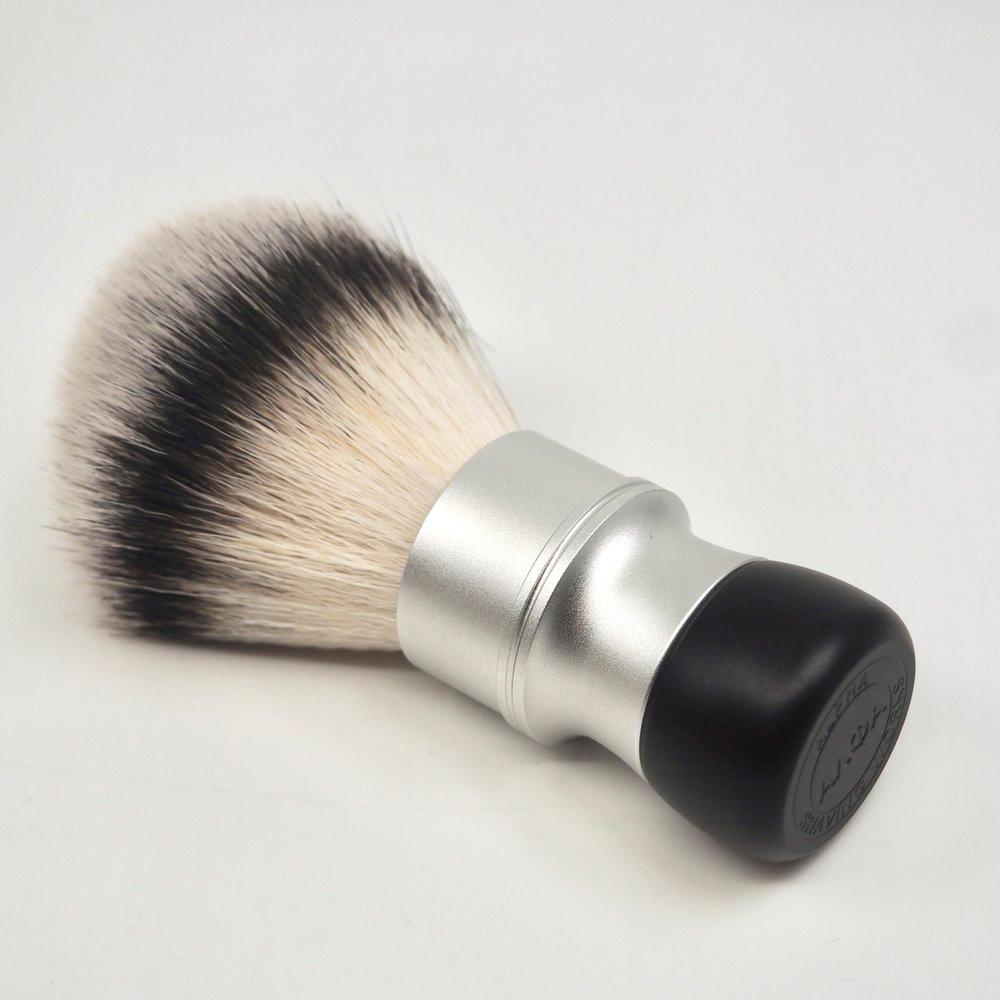 Alpha Brush & Shaving Co. Bandit GMac shaving brush with dense bristles and sleek handle for a smooth shave.